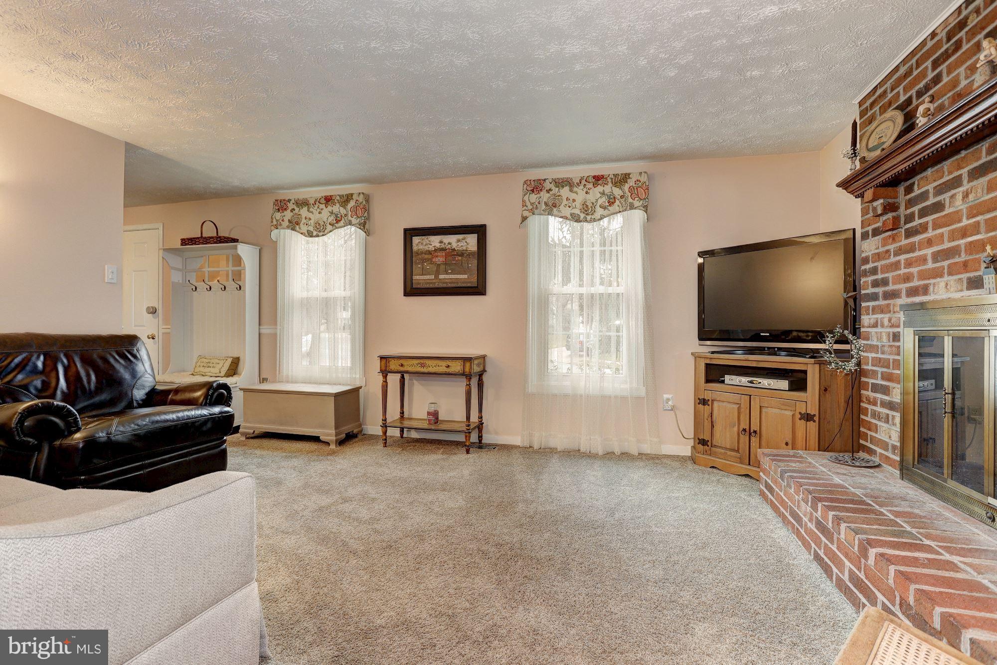 11 Class Court Baltimore, MD 21234 - Photo 4 of 25 a living room with furniture and a flat screen tv