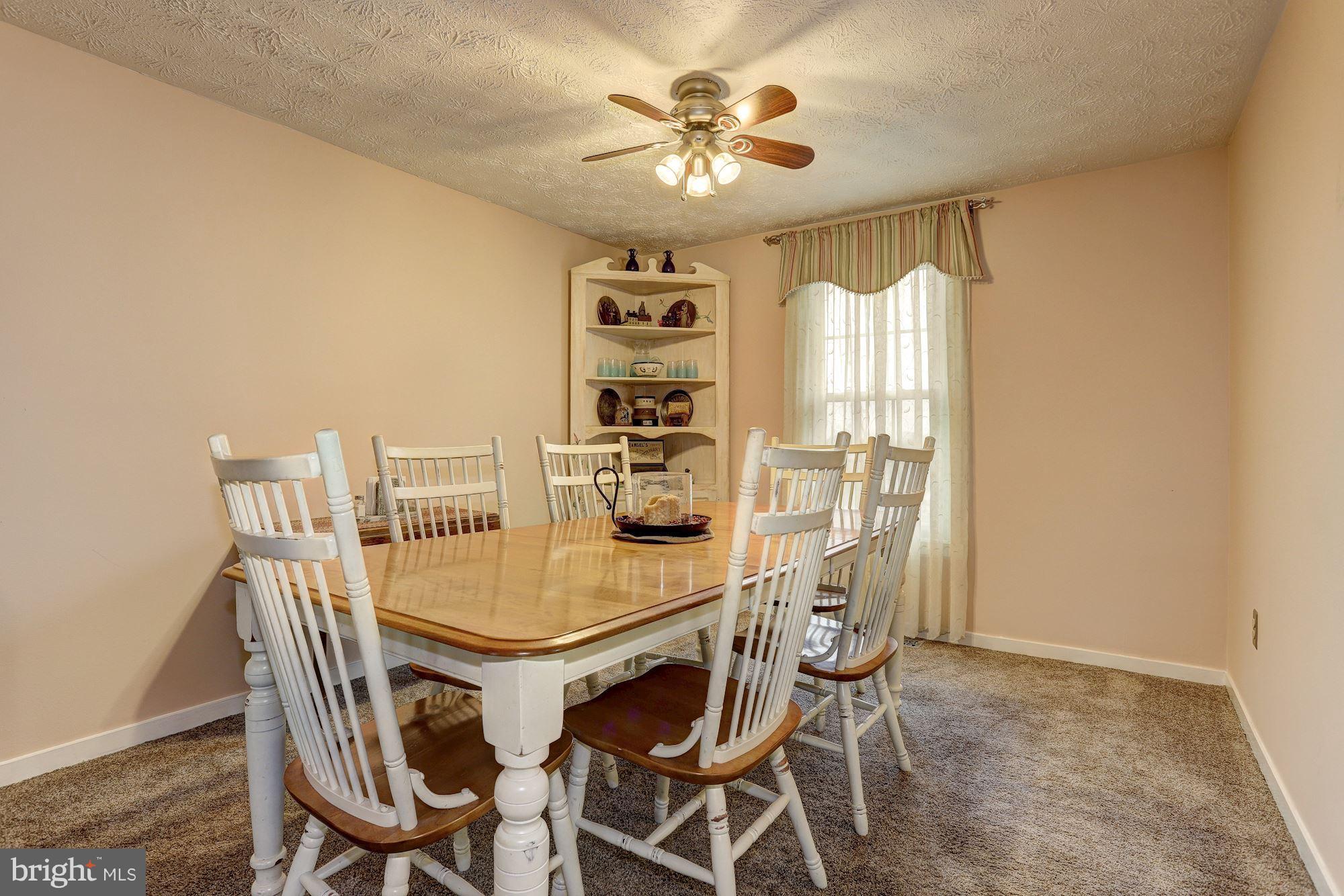 11 Class Court Baltimore, MD 21234 - Photo 6 of 25 a view of a dining room with furniture and a chandelier