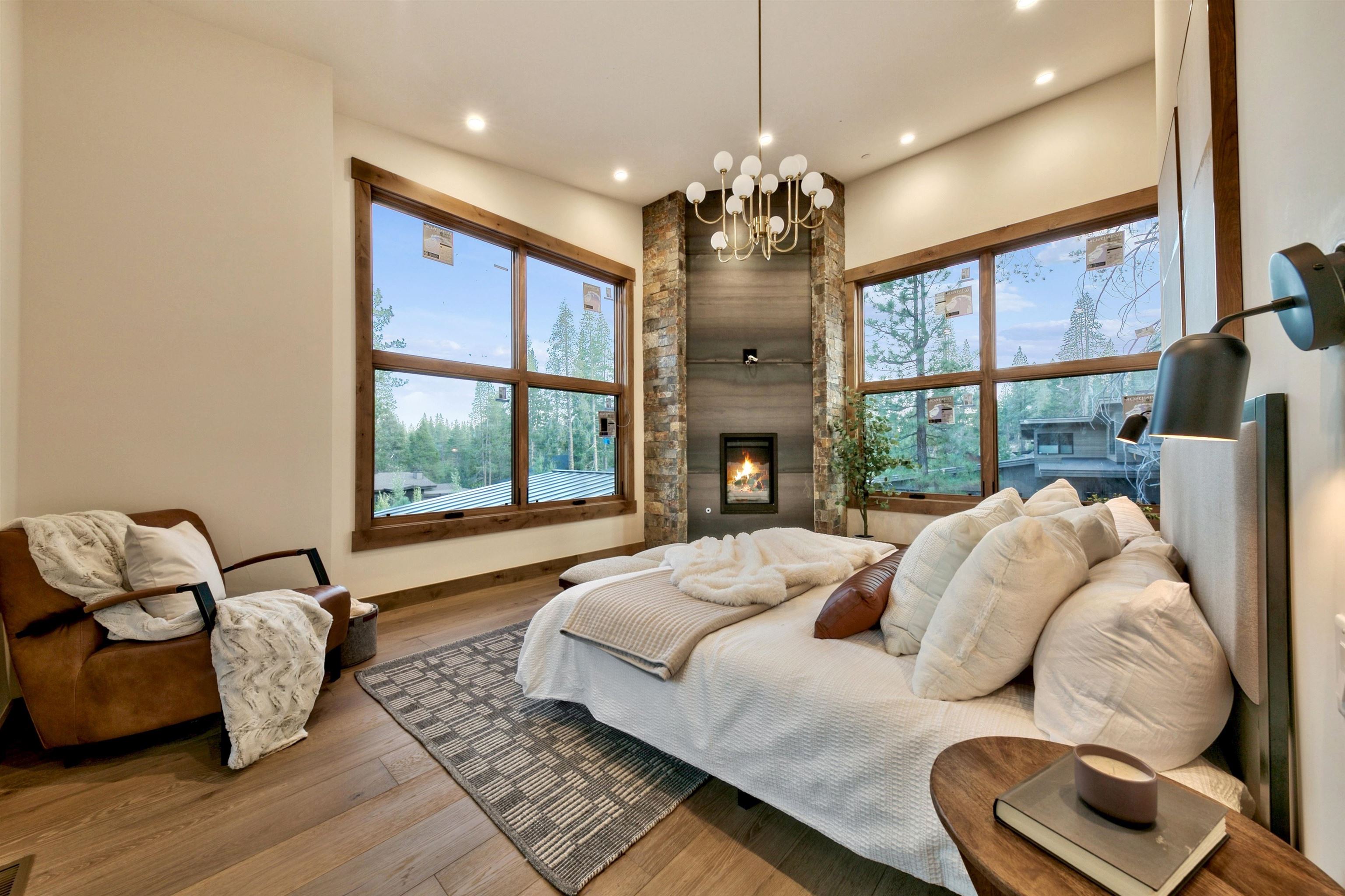 11620 Ghirard Road Truckee, CA 96161 - Photo 12 of 21 a bed room with a bed and a chandelier