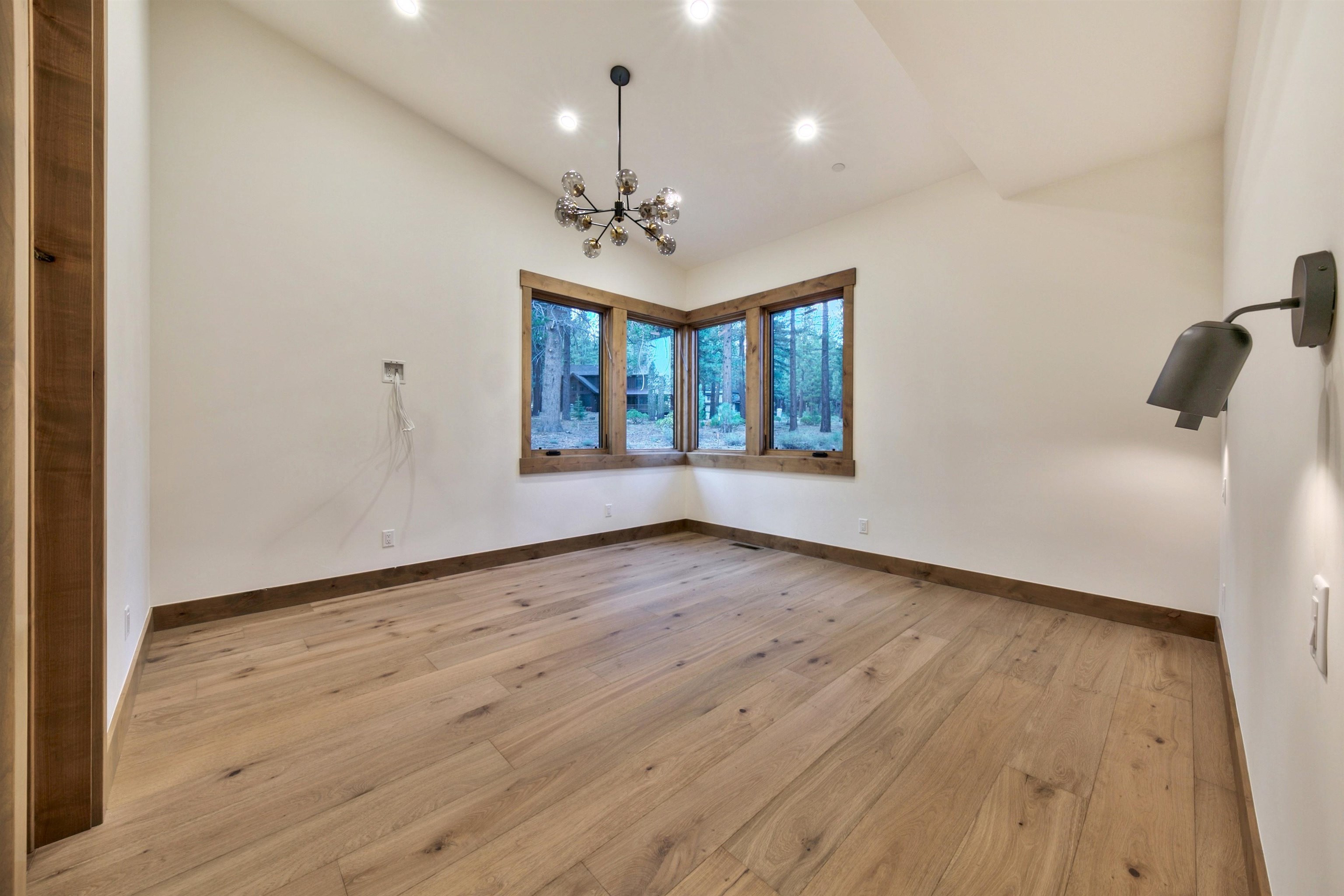 11620 Ghirard Road Truckee, CA 96161 - Photo 15 of 21 a view of an empty room with wooden floor and a window
