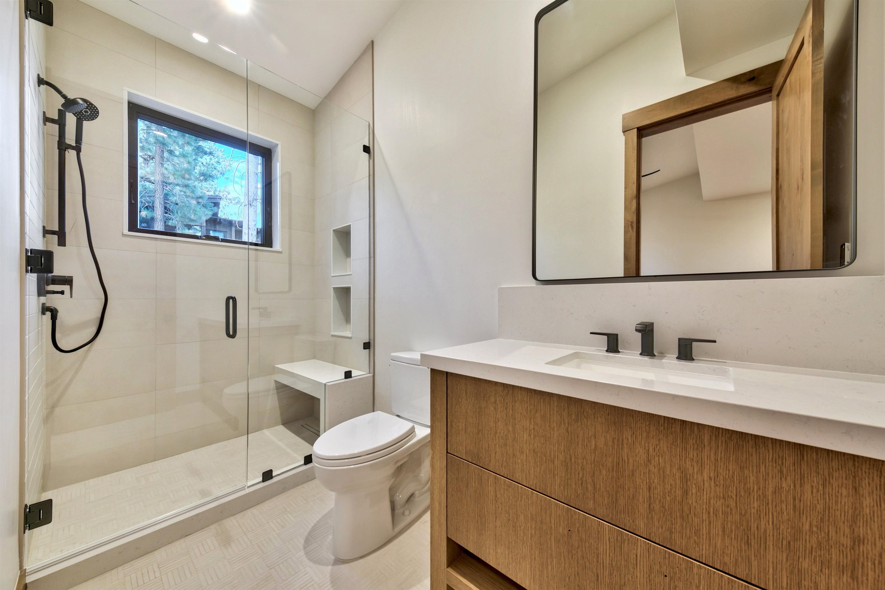 11620 Ghirard Road Truckee, CA 96161 - Photo 19 of 21 a bathroom with a toilet sink and mirror