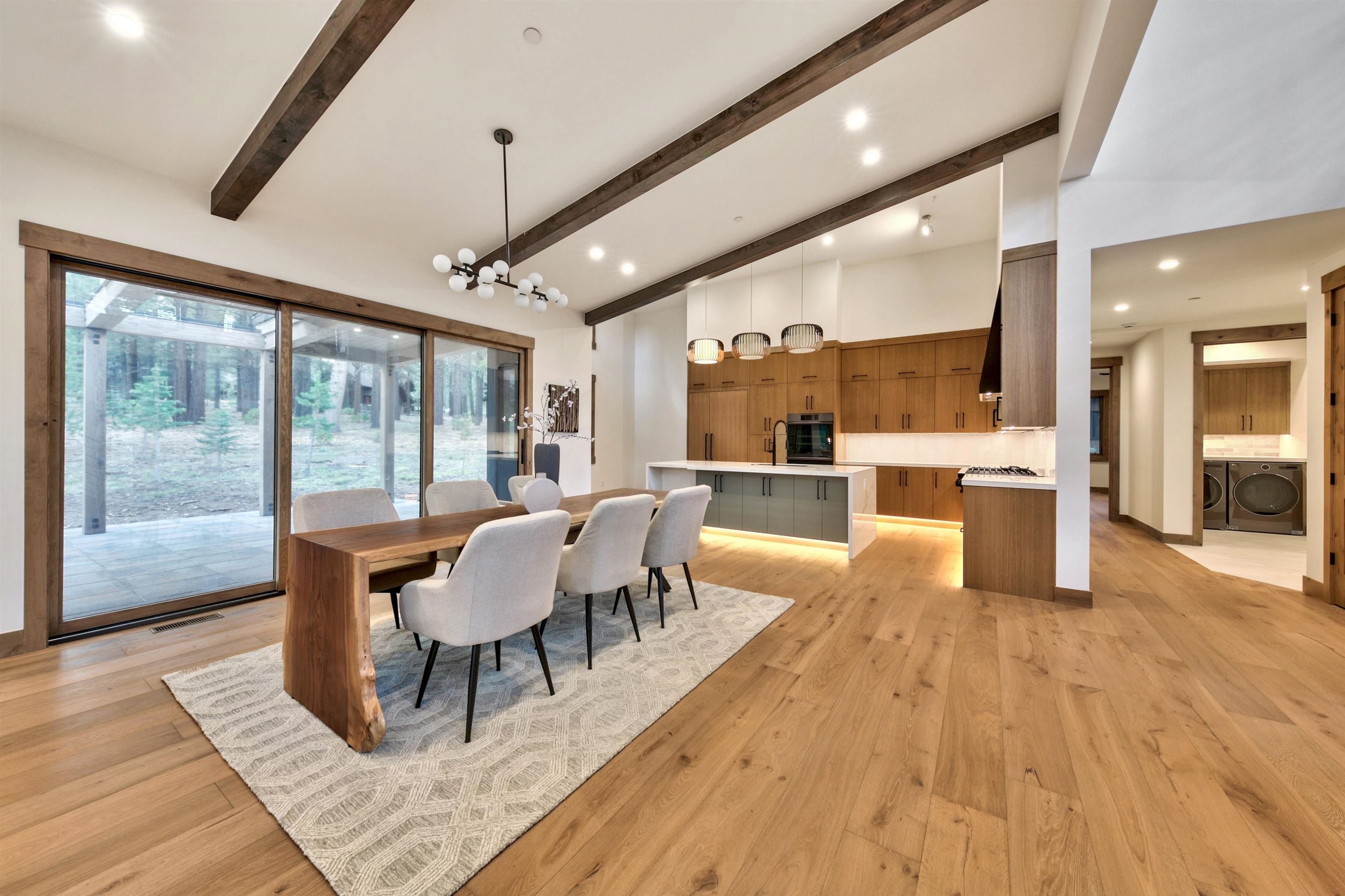 11620 Ghirard Road Truckee, CA 96161 - Photo 10 of 21 a dining room with wooden floor and large windows