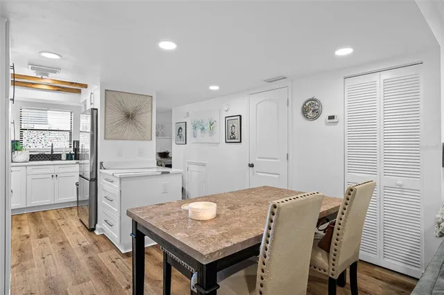 a open kitchen with a table and chairs in it