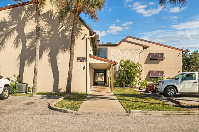 a view of a car park in front of a house