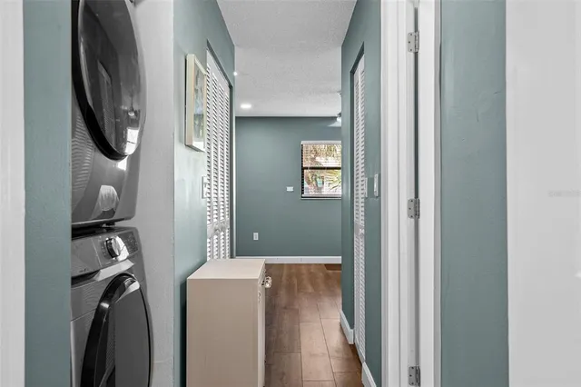 a view of a hallway with washer and dryer