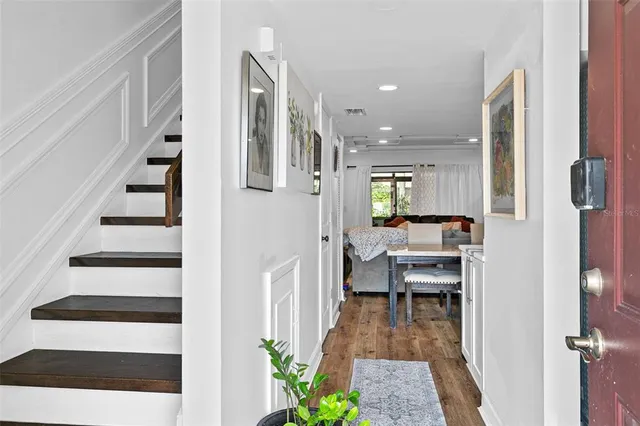 a view of a hallway with seating area