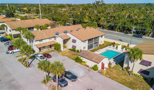 an aerial view of residential houses and outdoor space