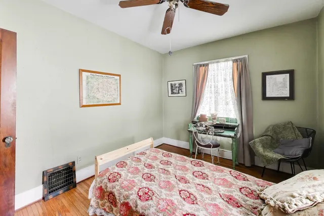 a bedroom with bed and a window