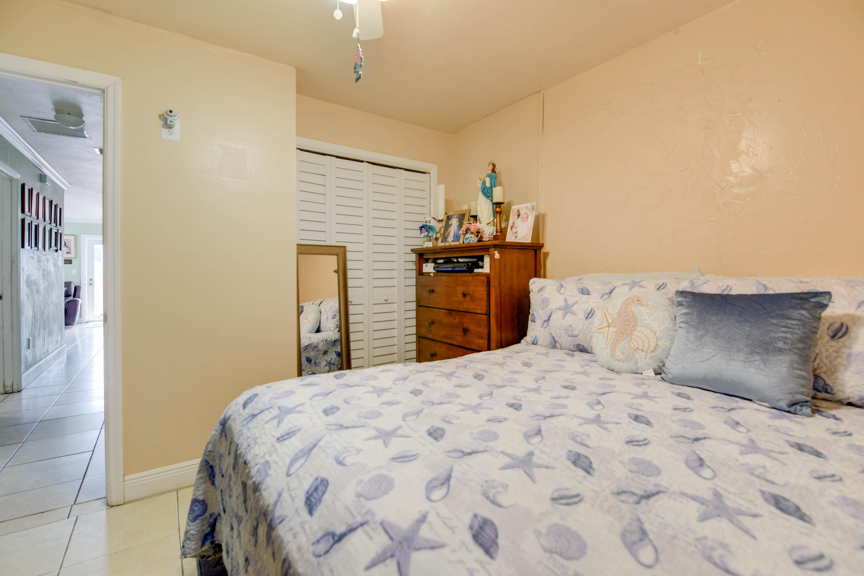 1524 5th Street Key West, FL 33040 - Photo 20 of 31 a bedroom with a bed and dresser with mirror