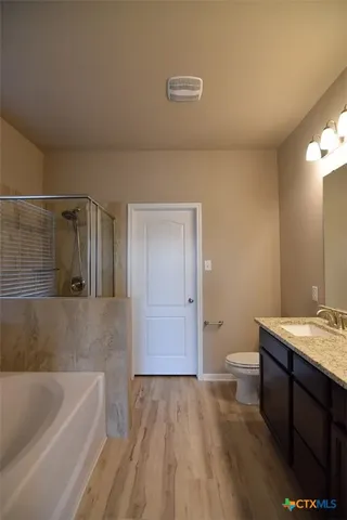a bathroom with a sink a toilet and bathtub