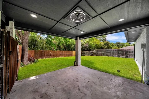 a view of a porch with a big yard