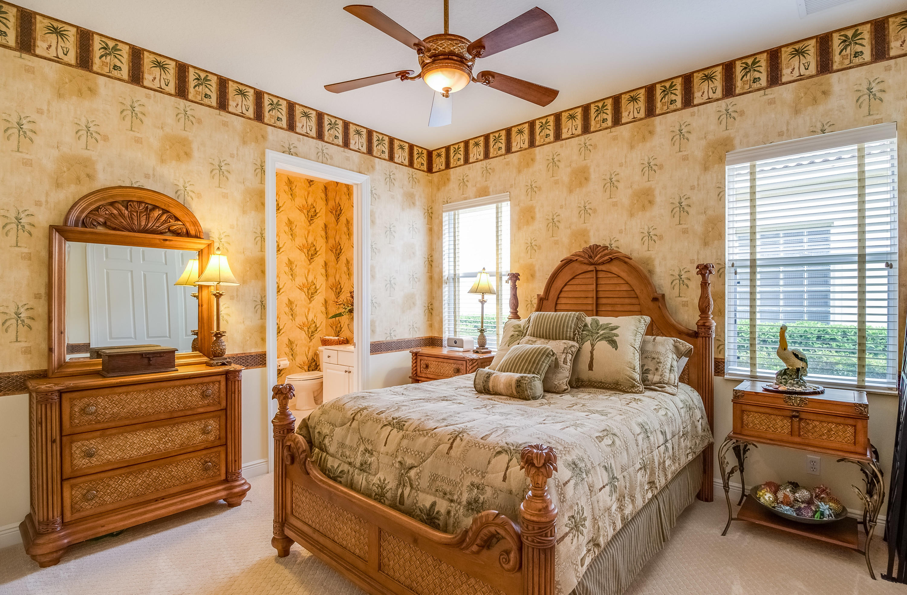 8617 Tompson Point Road Port St. Lucie, FL 34986 - Photo 28 of 38 a bedroom with a bed and a chandelier