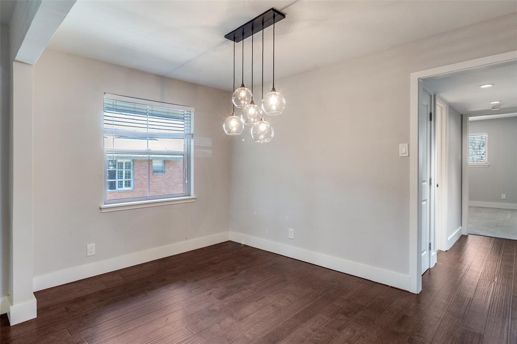 6159 Bandera Avenue Dallas, TX 75225 - Photo 4 of 13 a view of a room with wooden floor chandelier and entryway