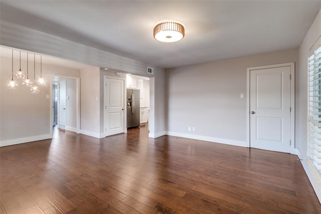 6159 Bandera Avenue Dallas, TX 75225 - Photo 5 of 13 a view of an empty room with wooden floor