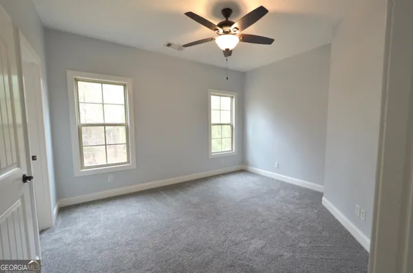 an empty room with an entryway and entrance