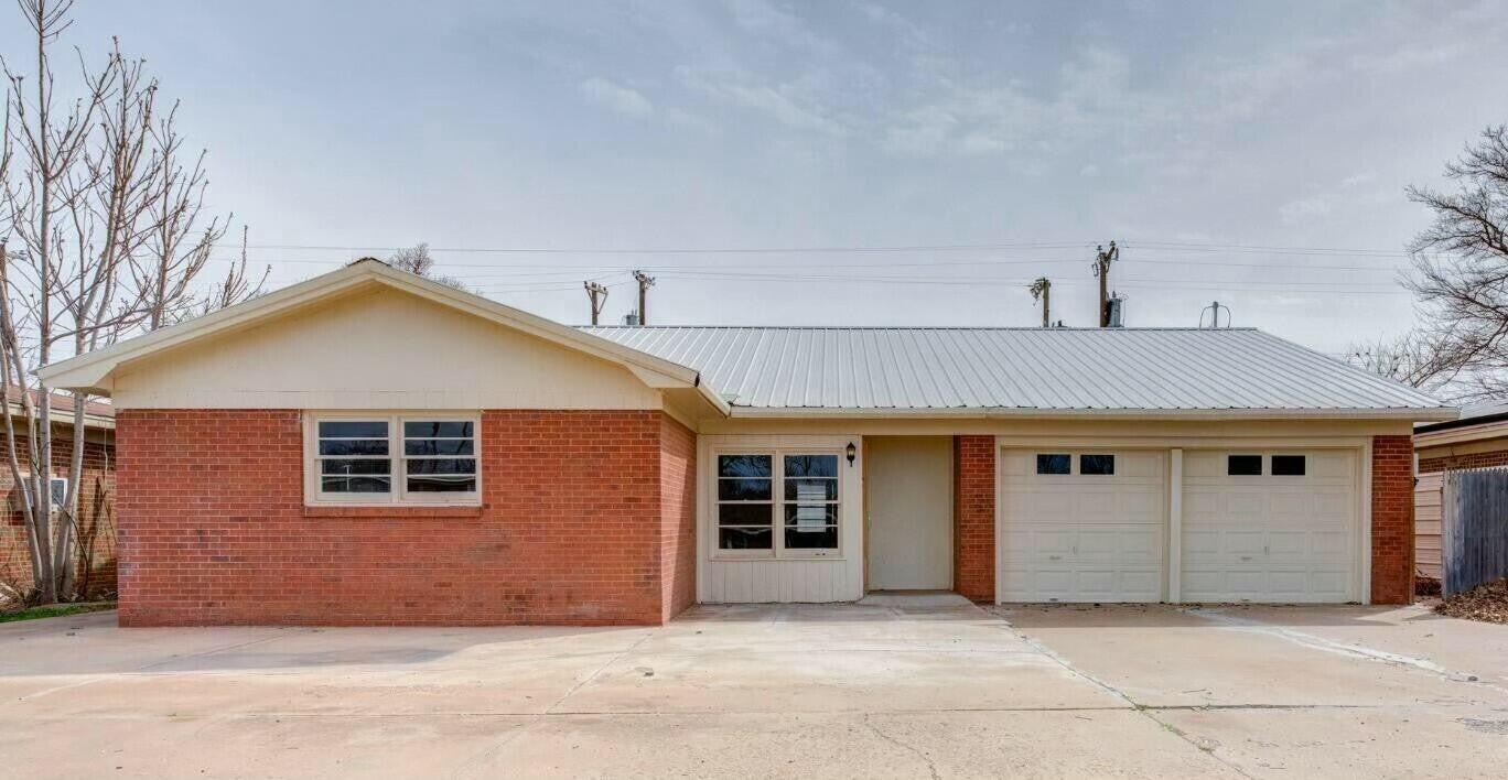 a front view of a house with a garage