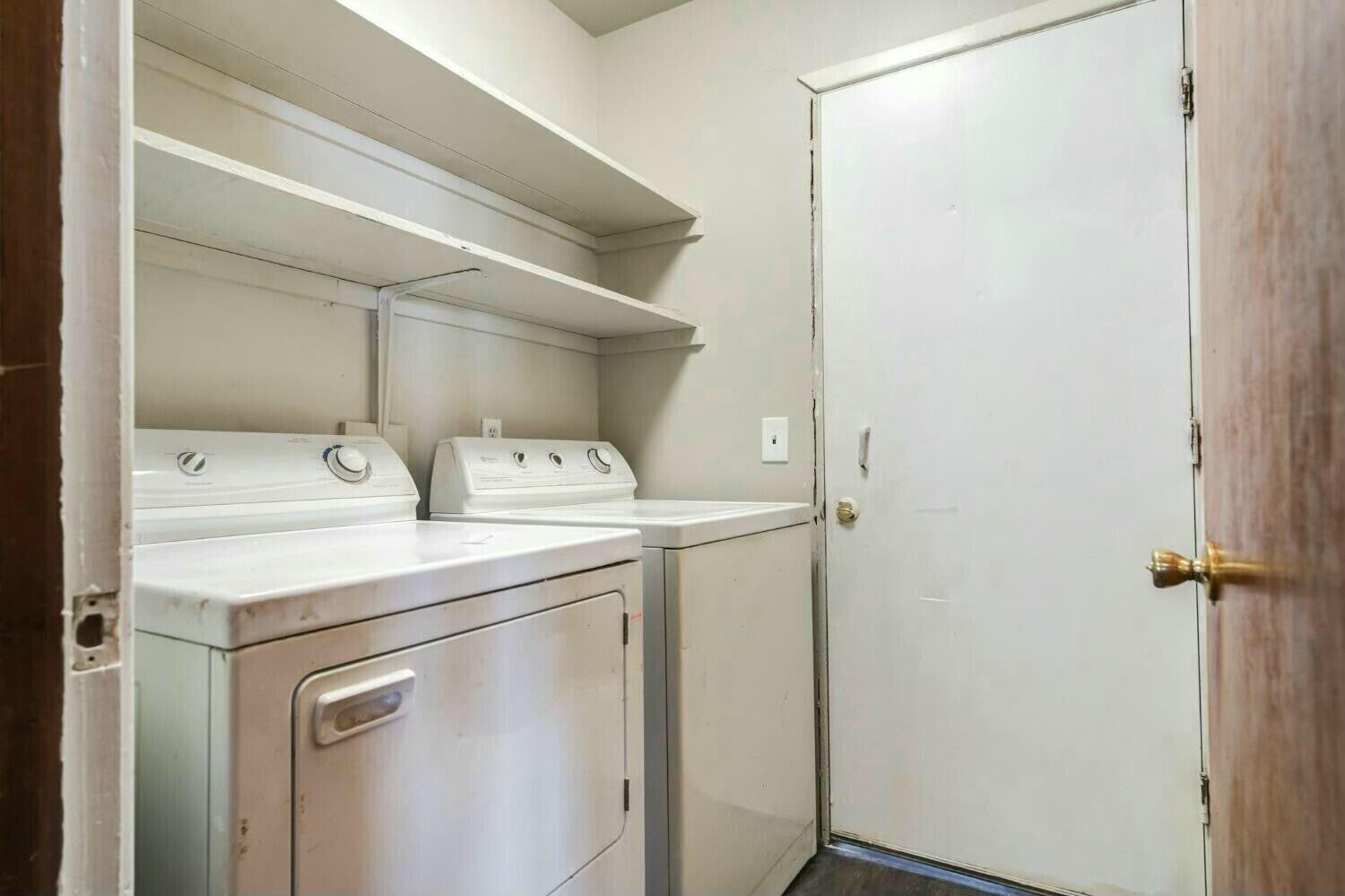 4407 49th Street Lubbock, TX 79414 - Photo 13 of 23 a utility room with dryer and washer