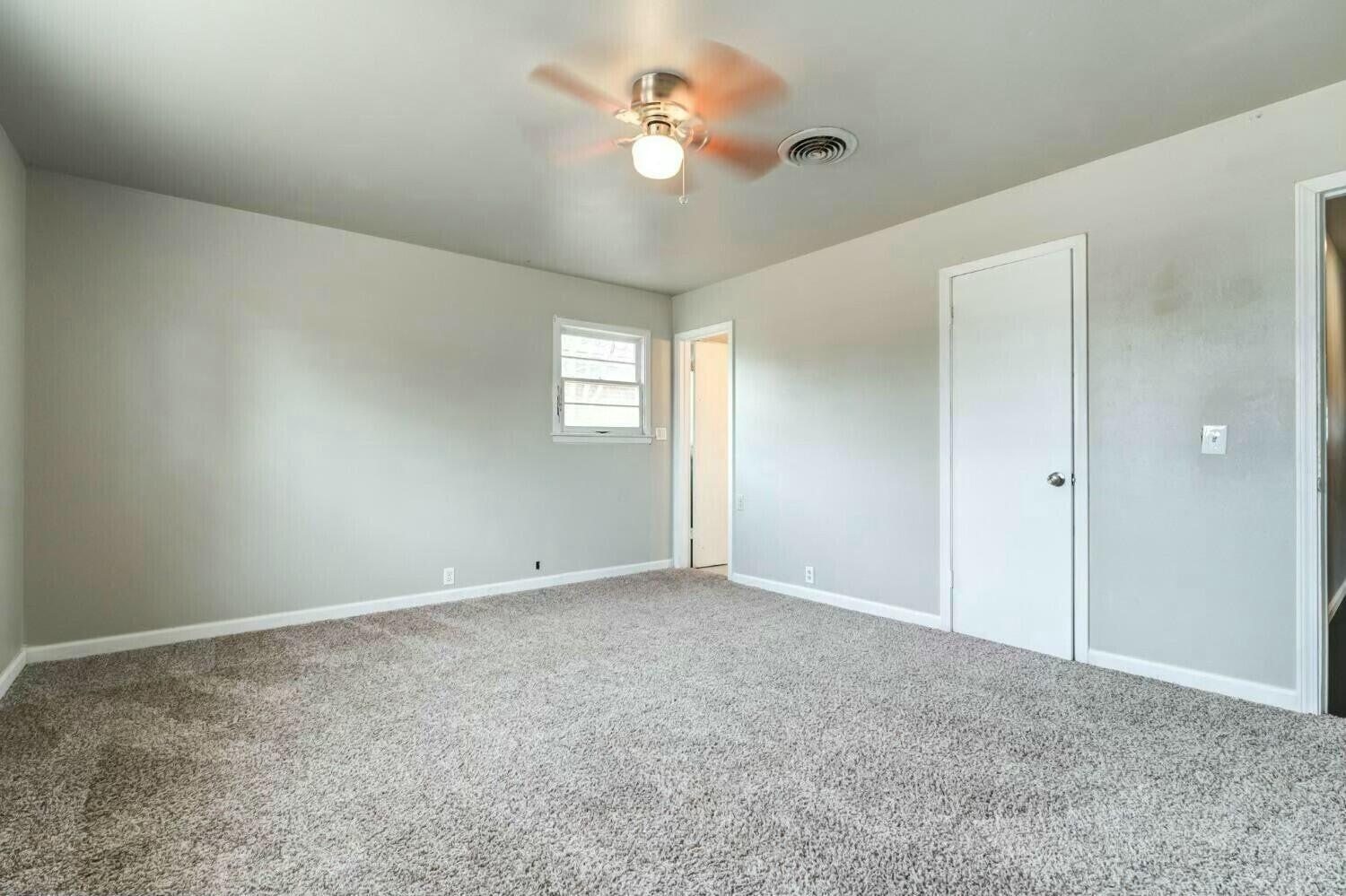 4407 49th Street Lubbock, TX 79414 - Photo 15 of 23 a view of an empty room with a window
