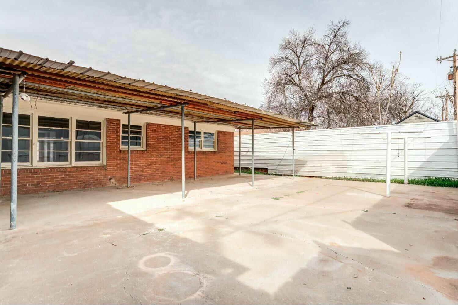 4407 49th Street Lubbock, TX 79414 - Photo 23 of 23 a view of a house with a snow on the road