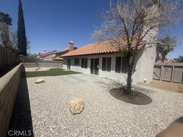 12590 Cobalt Road Victorville, CA 92392 - Photo 5 of 37 a house with swimming pool in front of it