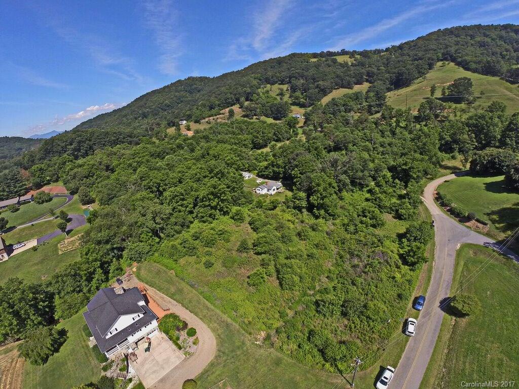 0 Reed Cove Road Waynesville, NC 28786 - Photo 1 of 4 an aerial view of a house with a yard
