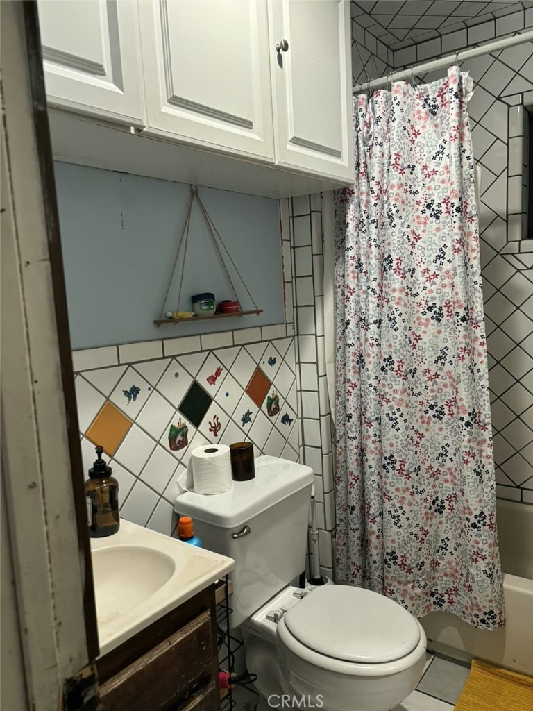 6911 Compton Avenue Los Angeles, CA 90001 - Photo 17 of 34 a bathroom with a sink toilet and shower