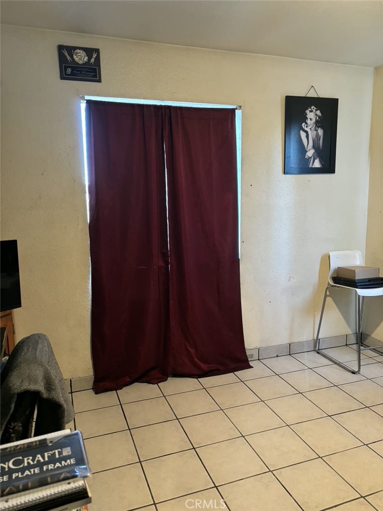 6911 Compton Avenue Los Angeles, CA 90001 - Photo 26 of 34 a view of kitchen with furniture and a window