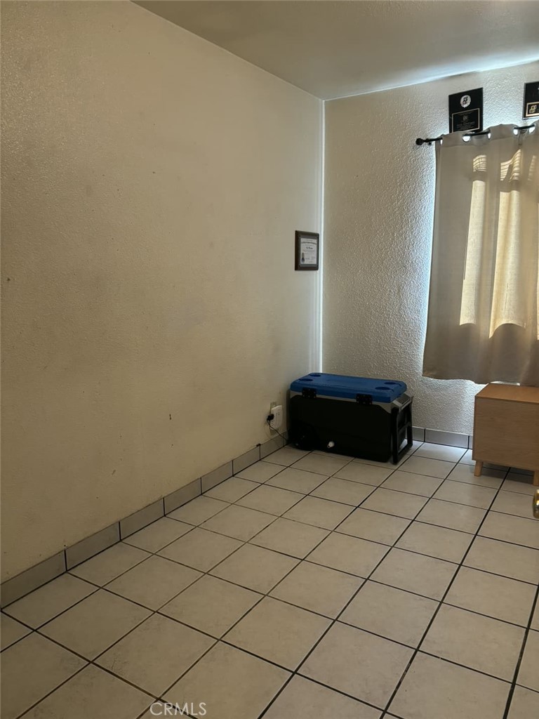6911 Compton Avenue Los Angeles, CA 90001 - Photo 31 of 34 a kitchen with a sink and a mirror