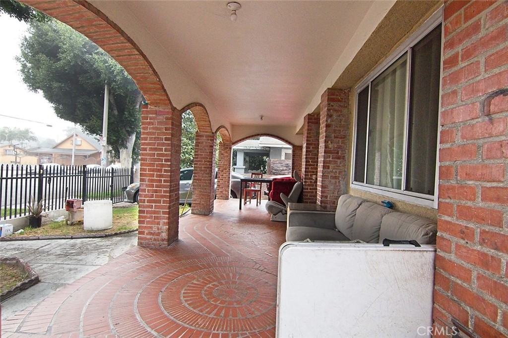 6911 Compton Avenue Los Angeles, CA 90001 - Photo 6 of 34 a view of living room with furniture and a fireplace