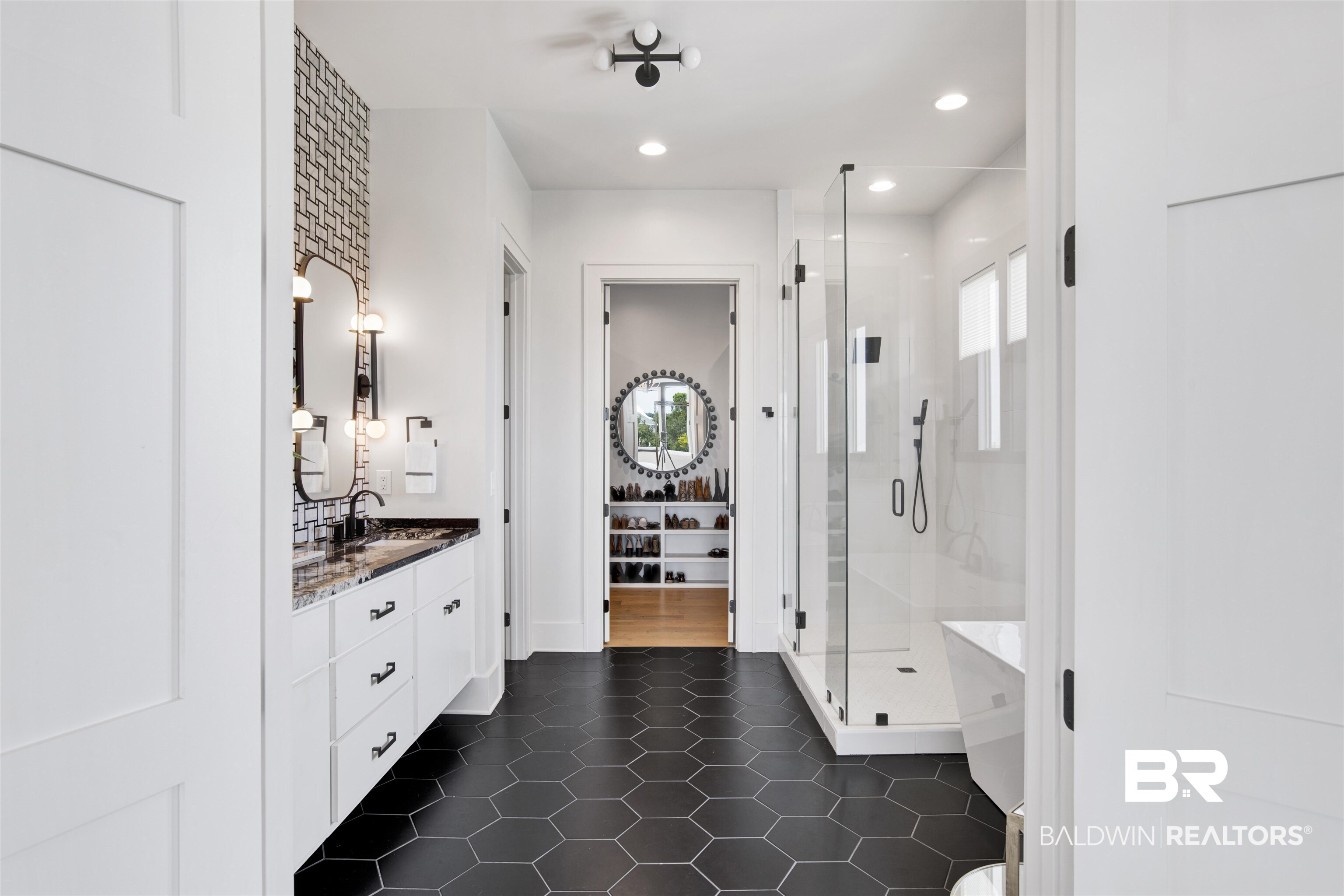 30239 Canal Court Orange Beach, AL 36561 - Photo 33 of 70 Full bath featuring healthy amount of natural light, vanity, a shower stall, dark tile patterned floors, and recessed lighting
