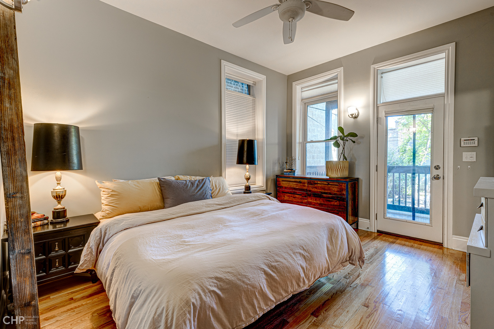 2116 West Potomac Avenue, Unit 1 Chicago, IL 60622 - Photo 12 of 24 a bedroom with a bed and wooden floor
