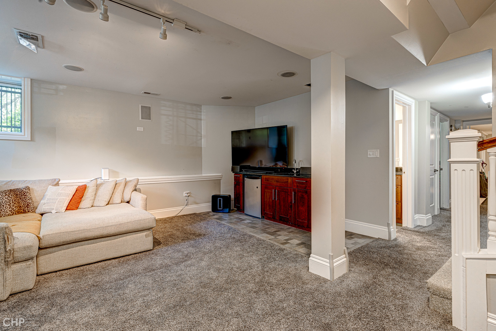 2116 West Potomac Avenue, Unit 1 Chicago, IL 60622 - Photo 15 of 24 a living room with a couch and a flat screen tv