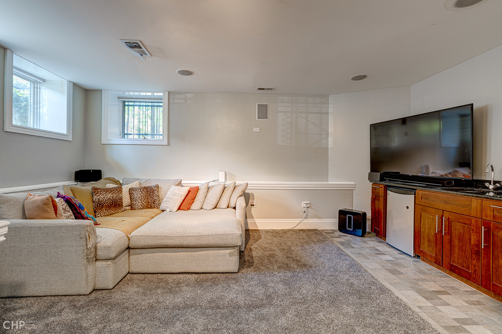 2116 West Potomac Avenue, Unit 1 Chicago, IL 60622 - Photo 16 of 24 a living room with furniture and a flat screen tv