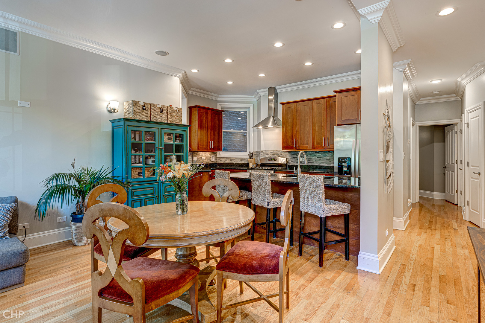 2116 West Potomac Avenue, Unit 1 Chicago, IL 60622 - Photo 2 of 24 a dining room with furniture and wooden floor