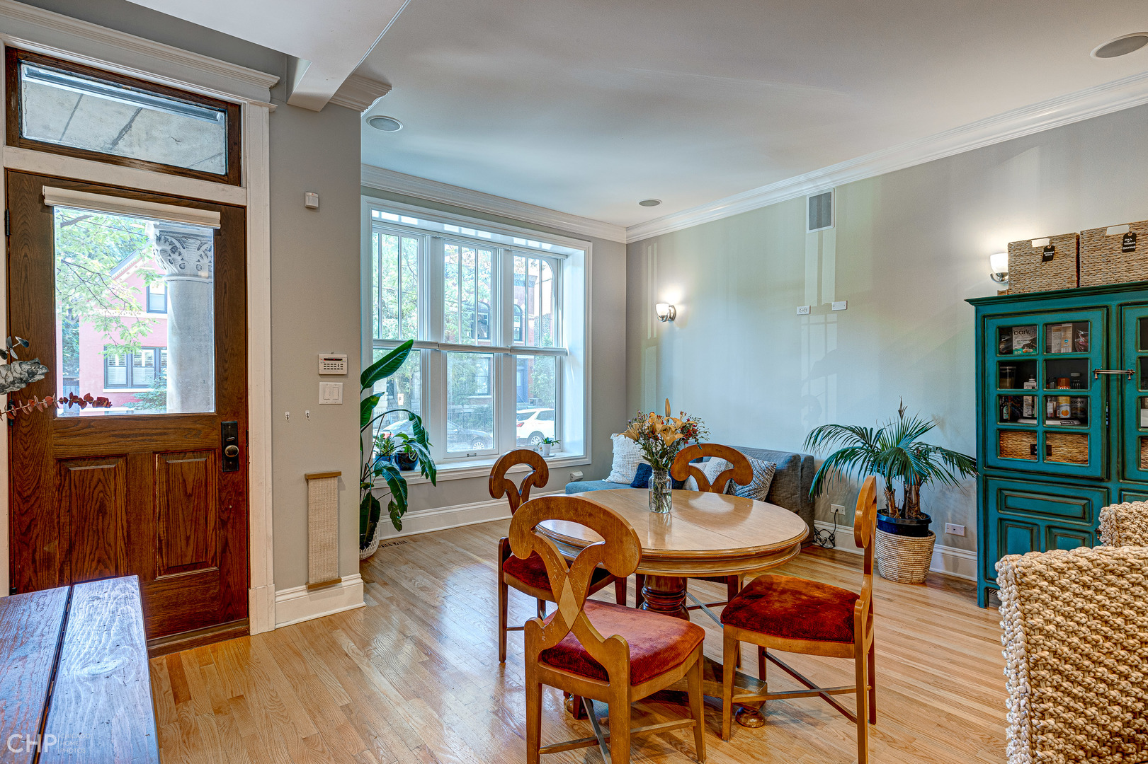 2116 West Potomac Avenue, Unit 1 Chicago, IL 60622 - Photo 5 of 24 a view of a dining room with furniture window and wooden floor