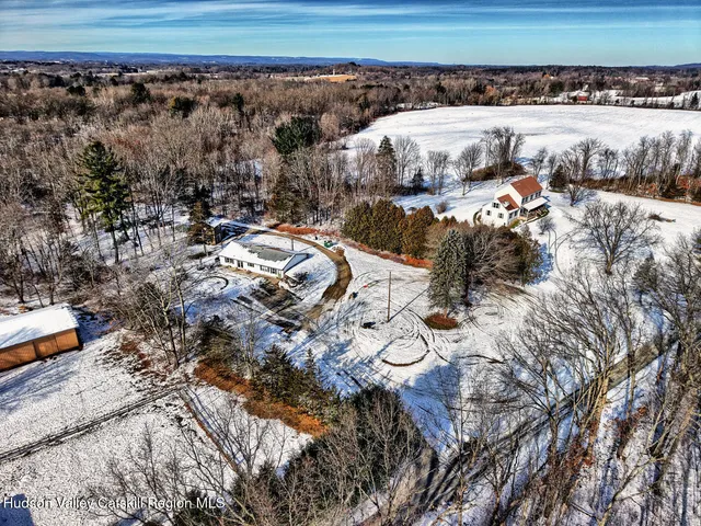 a kitchen with stainless steel appliances granite countertop a sink a stove and cabinets