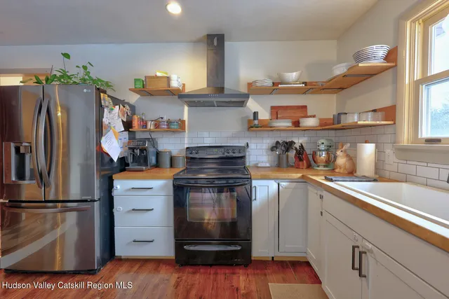 a bedroom with a bed and a mirror