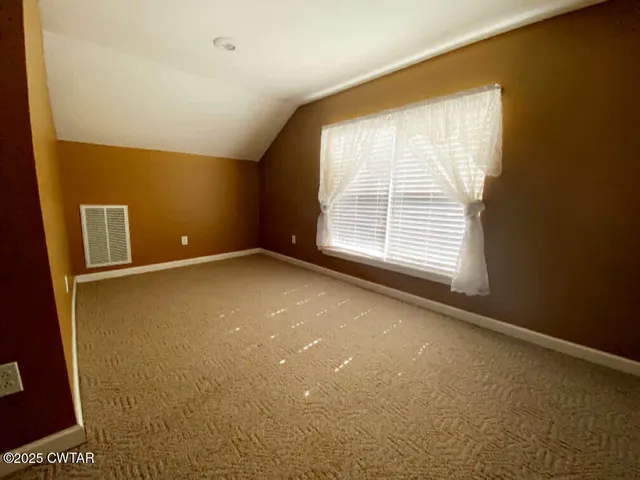 a view of a big room with windows