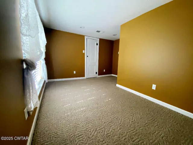 a bathroom with a double vanity sink mirror and shower