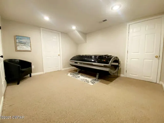 a bedroom with a bed and dresser