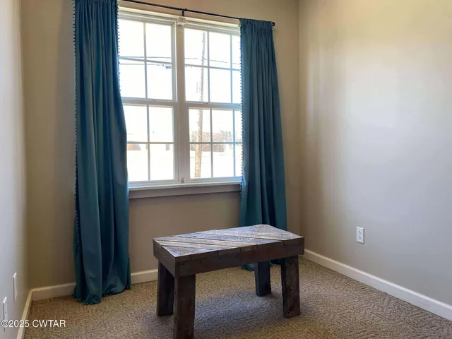 a view of yard with wooden fence