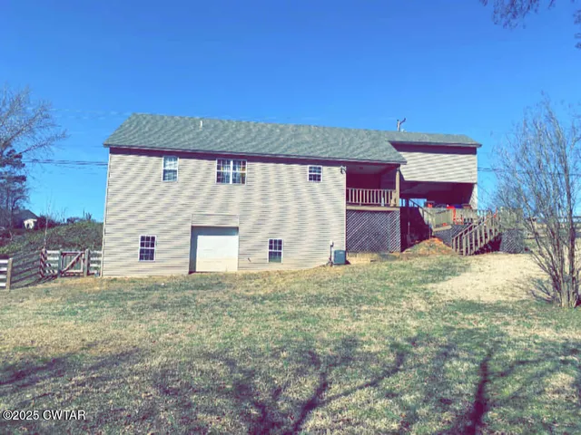 a view of back yard of the house