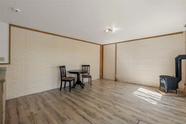 a view of a livingroom with furniture window and wooden floor
