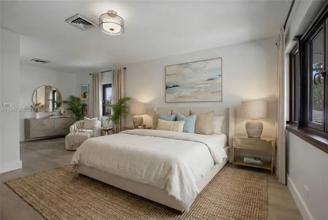 a bedroom with bed and window