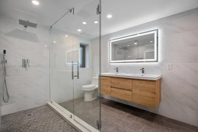 a bathroom with a bathtub sink and toilet