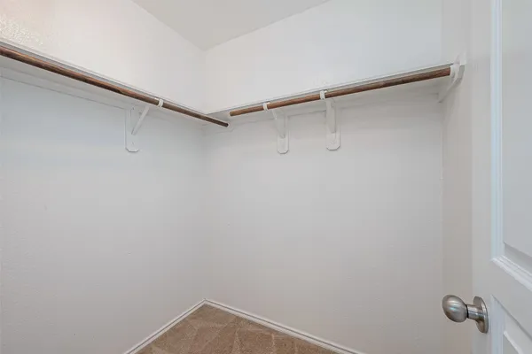 a view of a room with shelf on the wall