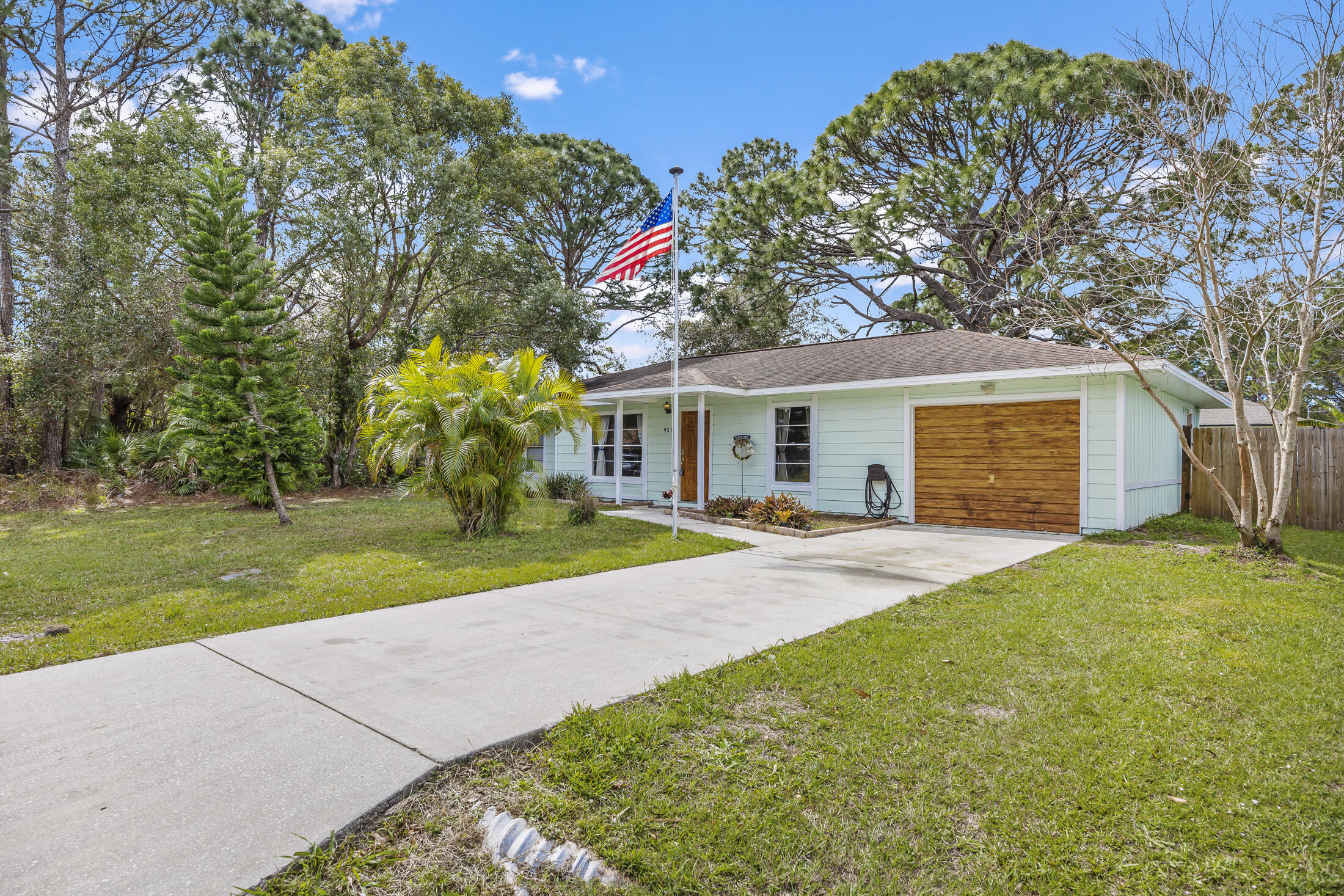 938 Cherokee Road Southeast Palm Bay, FL 32909 - Photo 1 of 29 a front view of house with yard and trees