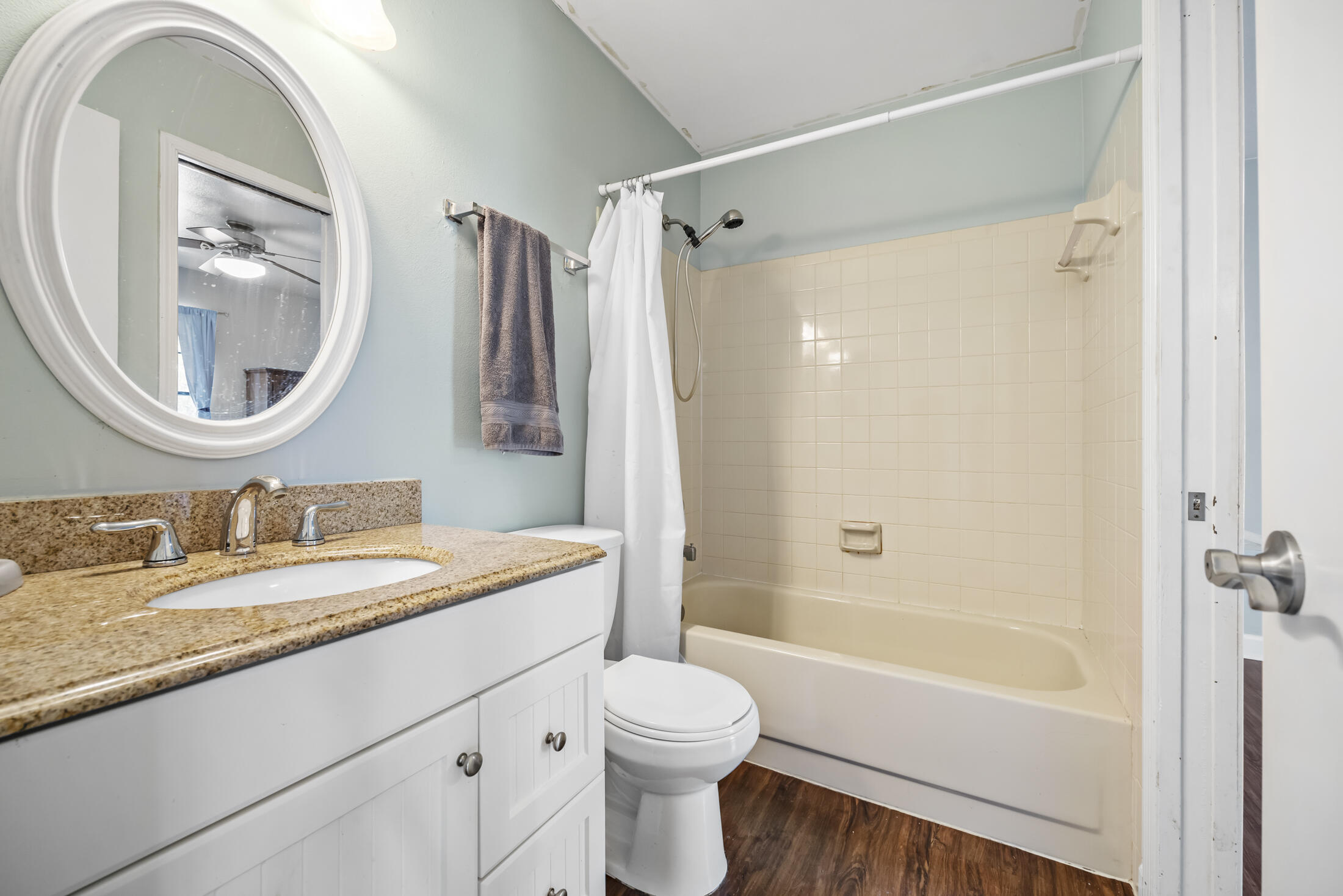 938 Cherokee Road Southeast Palm Bay, FL 32909 - Photo 18 of 29 a bathroom with a granite countertop sink toilet and shower