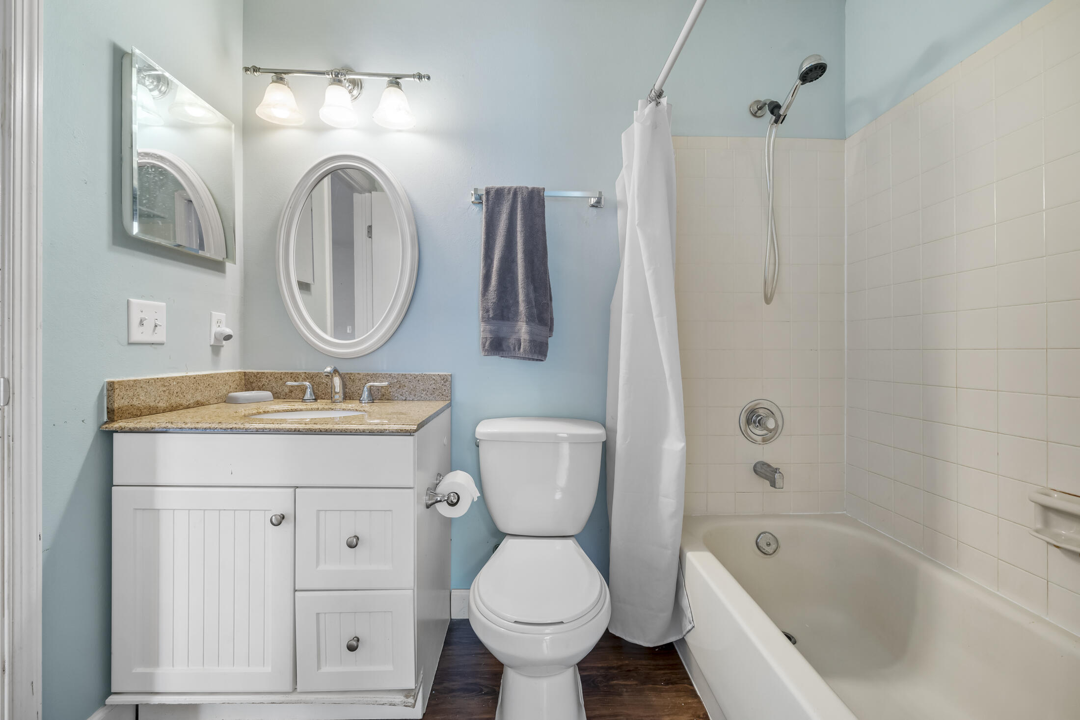938 Cherokee Road Southeast Palm Bay, FL 32909 - Photo 19 of 29 a bathroom with a toilet sink and mirror