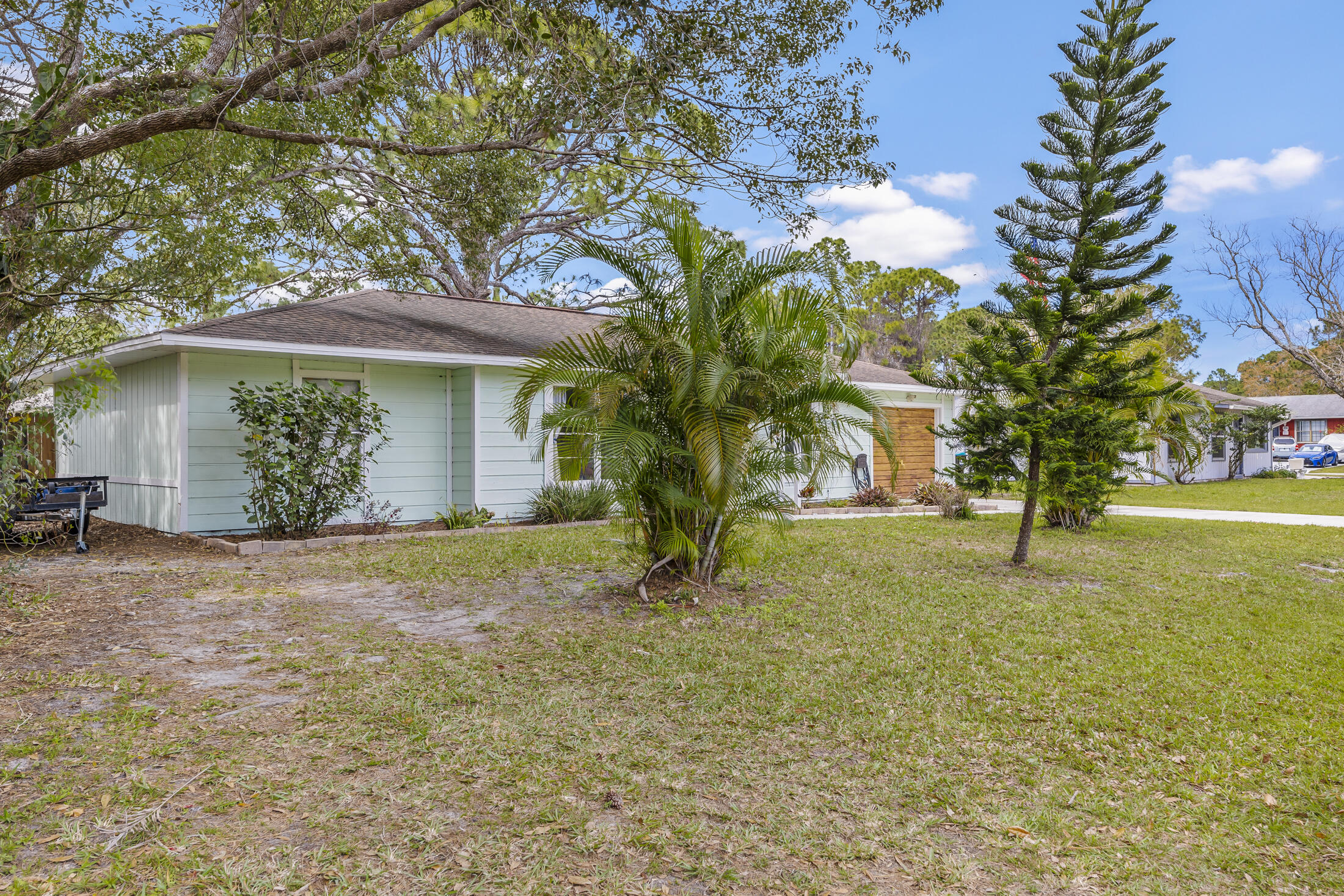 938 Cherokee Road Southeast Palm Bay, FL 32909 - Photo 4 of 29 a house with trees in front of it